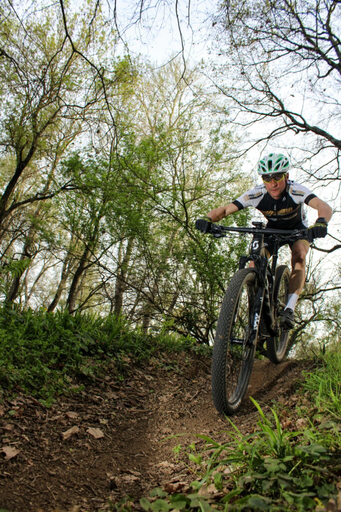 pexels photo 29507519 29507519 Mountain biker in action on a forest trail in Provence, France, capturing the thrill of outdoor adventure.
